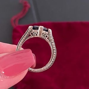 Beautiful sterling silver etched 1.5 carat simulated deep blue sapphire ring.
